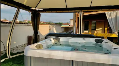 a hot tub on the back of a boat at Hani Guest House in Garmen