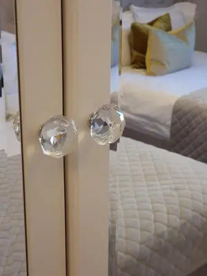 a reflection of a bedroom with a bed in a mirror at Sofia Royal Retreat in Sofia