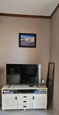 a large flat screen tv on a wall at Four Seasons Apartment Bansko in Bansko