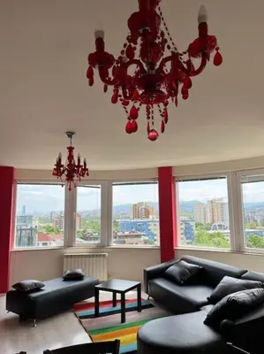 a living room with a chandelier and a couch at The best choice in Sofia in Sofia