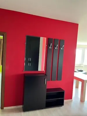 a red wall with lockers in a room at The best choice in Sofia in Sofia