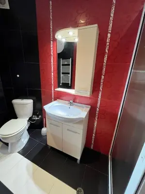 a bathroom with a toilet and a sink and a mirror at The best choice in Sofia in Sofia