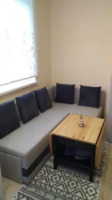 a living room with a couch and a coffee table at Apartament Sofia in Sofia