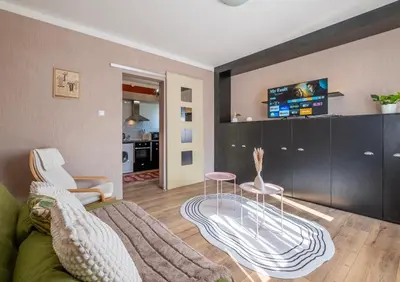a living room with a couch and a tv at #Maison\u32b6 - A Vibrant, Urban Stay in Sofia