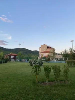 a park with trees in the middle of a field at Vacation house in Pravets golf resort At Pravets Lake in Pravets