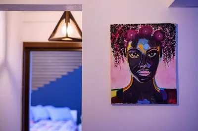a painting of a black woman hanging on a wall at 10 Seconds Away from the Main street, Free Secured Parking in Sofia