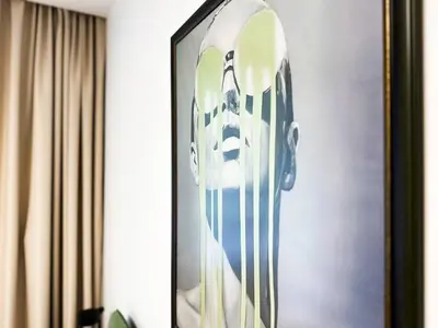 a framed picture of a mask on a wall at 2BR by NDK - AC - Desk - Lux Interior - Balcony in Sofia