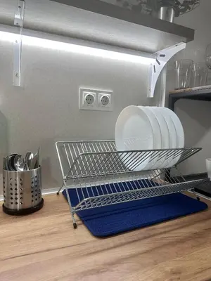 a dish drying rack with a plate and plates at The rainbow 8 in Sofia