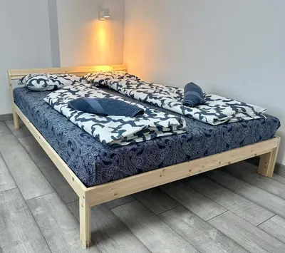 a bed in a room with two pillows on it at The rainbow 8 in Sofia