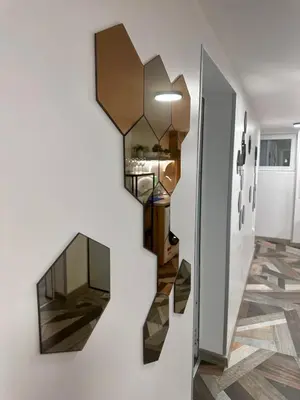 a staircase in a house with a mirror on the wall at The rainbow 8 in Sofia