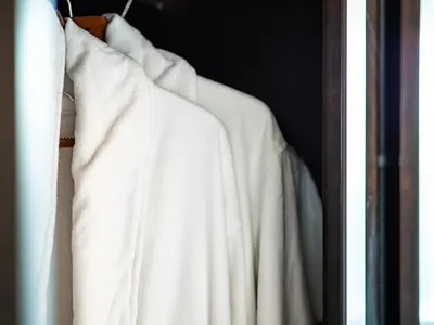a row of white shirts hanging in a closet at Center Square Vitosha Blvd Panorama in Sofia