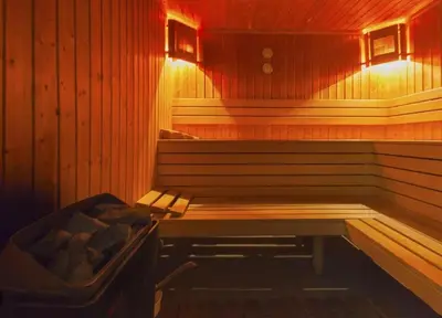 a sauna with a bench and a tub in it at Apartament by Zenit in Terra Complex Massonet D28 near Bansko in Razlog