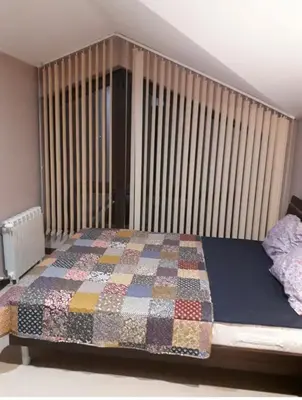 a bedroom with a bed with a quilt on it at Apartament by Zenit in Terra Complex Massonet D28 near Bansko in Razlog