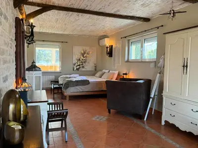 a bedroom with a bed and a living room at Villa Boyana City & Relax with Hot Jacuzzi and Sauna by BookVillaBG in Sofia