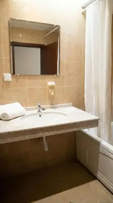 a bathroom with a sink and a mirror at Mountain Paradise 2 - Cosy Mountain View Apartment - 200mbps Wifi in Bansko