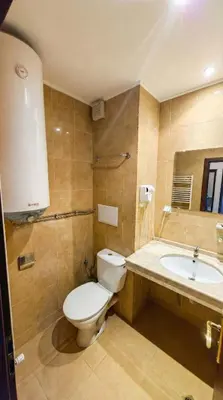 a bathroom with a toilet and a sink at Mountain Paradise 2 - Cosy Mountain View Apartment - 200mbps Wifi in Bansko