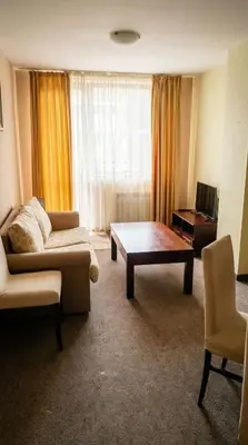 a living room with a couch and a coffee table at Mountain Paradise 2 - Cosy Mountain View Apartment - 200mbps Wifi in Bansko