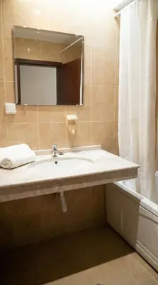 a bathroom with a sink and a mirror at Mountain Paradise 2 - Cosy Mountain View Apartment - 200mbps Wifi in Bansko