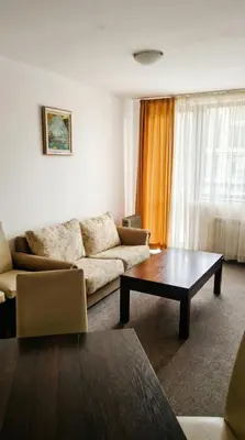 a living room with a couch and a coffee table at Mountain Paradise 2 - Cosy Mountain View Apartment - 200mbps Wifi in Bansko