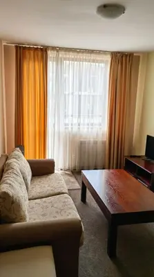 a living room with a couch and a coffee table at Mountain Paradise 2 - Cosy Mountain View Apartment - 200mbps Wifi in Bansko