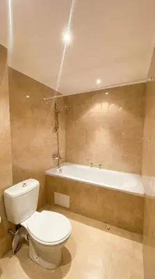 a bathroom with a toilet and a bath tub at 1BR Bright 300mbps WIFI Duplex - Two Floors in Bansko