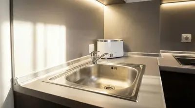 a stainless steel sink in a kitchen with a coffee maker at Mountain Paradise 2 - Quiet Cosy Studio - Balcony, Wifi in Bansko