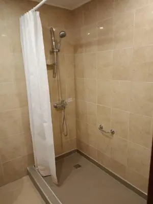 a shower with a shower curtain in a bathroom at Mountain Paradise 1 - 1 Bedroom South facing balcony - 300mbps Wi-fi in Bansko