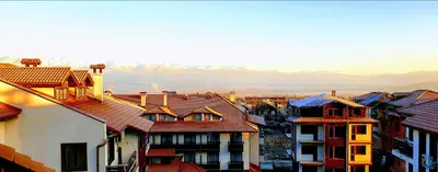a group of houses with mountains in the background at Mountain Paradise 1 - 1 Bedroom South facing balcony - 300mbps Wi-fi in Bansko