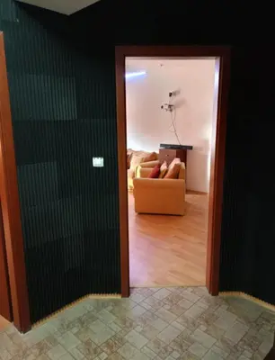 a doorway into a living room with a couch at Mountain Paradise 1 - 1 Bedroom South facing balcony - 300mbps Wi-fi in Bansko