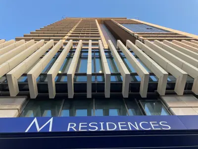 a view of a building with the m reserves logo on it at Point Sofia Grand Suite in Sofia