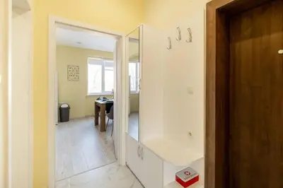 a bathroom with a walk in shower and a mirror at Central located 1BDR peaceful apt Fast Wi-fi in Sofia