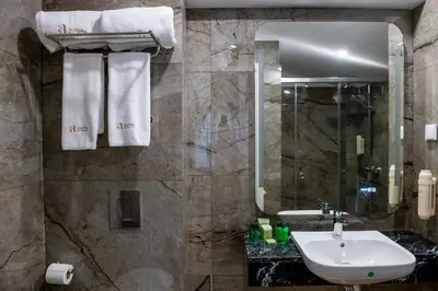 a bathroom with a sink and a mirror at Agora Boutique Hotel in Sofia