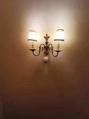 a light on a wall with two lamps on it at Serdika Old City House in Sofia