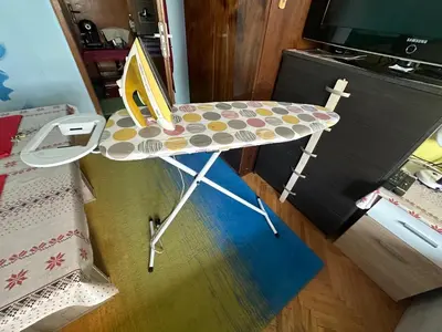 a colorful chair sitting in front of a tv at Sleep & fly in Sofia