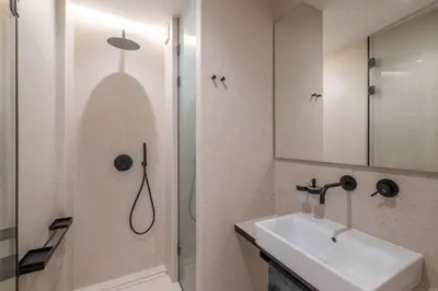 a bathroom with a sink and a shower and a sink at Top-Notch location, an Exceptionally Stylish flat in Sofia