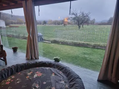 a view of a field from a bedroom window at Villa Nikol Apt #2 in Raduil