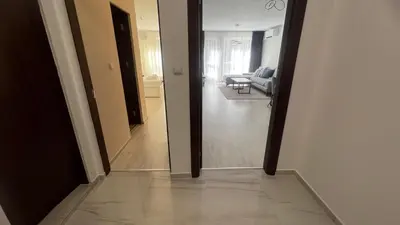 a view of a hallway with a living room at Soflu apartments Plovdiv in Plovdiv