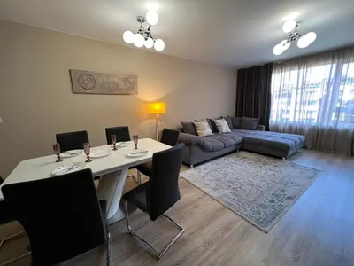 a living room with a table and a couch at Johannesburg 2BDR Spacious Family apt w Parking and Playground in Sofia