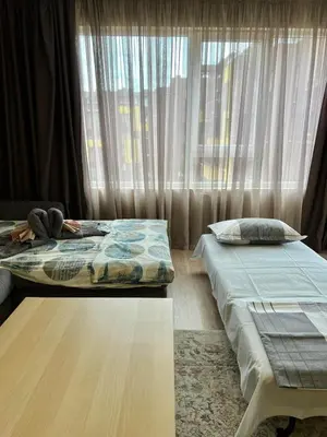 two beds sitting in a room with a window at Johannesburg 2BDR Spacious Family apt w Parking and Playground in Sofia