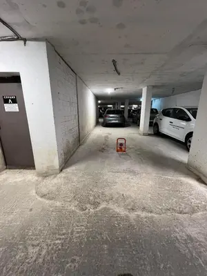 a parking garage with two cars parked in it at Johannesburg 2BDR Spacious Family apt w Parking and Playground in Sofia