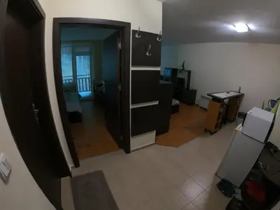 an open door to a room with a living room at Apartment in Forest Glade Hotel in Pamporovo