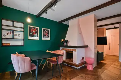 a living room with a table and a fireplace at Lozenetz Gem Cozy 1-Bedroom Apartment in Sofia by Flat Mаnager in Sofia