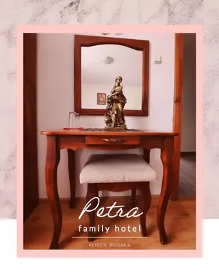 a wooden table with a mirror and a chair at Petra Hotel in Petrich