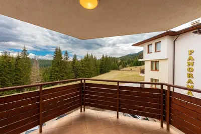 a balcony with a view of the mountains at Panorama Studio in Stoykite