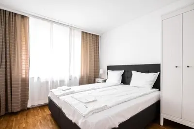 a bedroom with a large bed with white sheets at Contemporary Comfort 1BD Flat in Lozenetz, Sofia by Flat Mаnager in Sofia