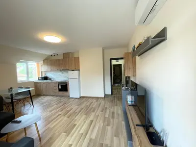 a kitchen and living room with a hard wood floor at Hancho - Velingrad - Marvel Apartament in Velingrad