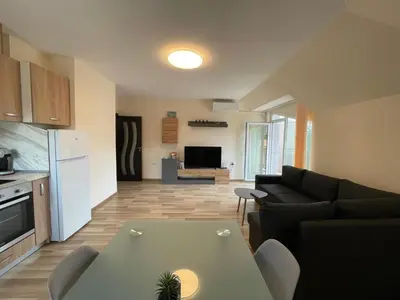 a living room with a couch and a table at Hancho - Velingrad - Marvel Apartament in Velingrad