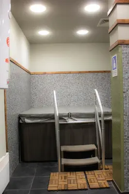 a waiting room with a sink and two chairs at Aspen Valley Sun Rays A102 in Razlog