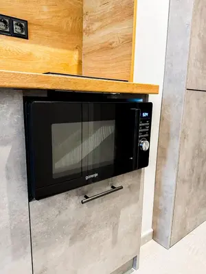 a microwave oven on a counter in a kitchen at 6 Studios 6 Bathrooms 2 Levels Kitchens in Sofia