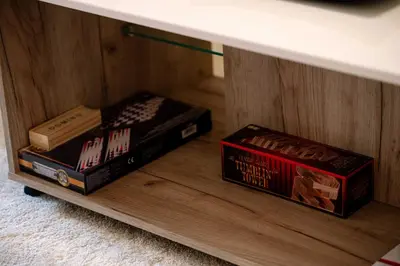 two books are sitting on a book shelf at Vivid Condo by NDK and Vitosha Blvd with Free Secured Parking and AC in Sofia